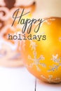 New Years Christmas greeting card. Bright yellow golden ornament ball with sparkling silver snow flake pattern. Angel. Lettering Royalty Free Stock Photo