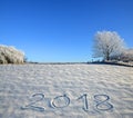 New Years date 2018 written in fresh snow.