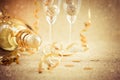 New years eve celebration background with champagne, glasses and ornaments Royalty Free Stock Photo