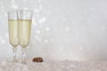 New Years Eve celebration background with champagne glasses on snow Royalty Free Stock Photo