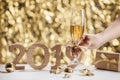 New Years Eve celebration background with pair of flutes, bottle Royalty Free Stock Photo
