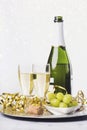 New Years Eve celebration concept background. Champagne with glass and grapes Royalty Free Stock Photo