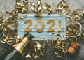 New Years Eve celebration concept background.Medical mask with the numbers 2021 and Champagne bottle with glasses .Covid-19 New Royalty Free Stock Photo