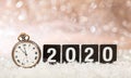 2020 New Years eve celebration. Minutes to midnight on an old watch, bokeh festive Royalty Free Stock Photo