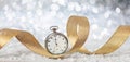 New Years eve celebration party. Minutes to midnight on an old watch, bokeh festive background Royalty Free Stock Photo
