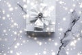 Luxury holiday gifts with white silk bow and ribbons on marble background, Christmas time surprise