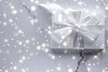 Luxury holiday gifts with white silk bow and ribbons on marble background, Christmas time surprise