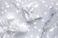 Luxury holiday gifts with white silk bow and ribbons on marble background, Christmas time surprise