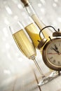 New Years Eve - champagne and alarm clock Royalty Free Stock Photo