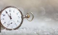 New Years eve countdown. Minutes to midnight on an old fashioned pocket watch, bokeh background Royalty Free Stock Photo