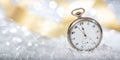 New Years eve countdown. Minutes to midnight on an old pocket watch, bokeh background Royalty Free Stock Photo