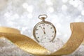 New Years eve countdown. Minutes to midnight on an old watch, bokeh festive Royalty Free Stock Photo