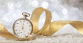 New Years eve countdown. Minutes to midnight on an old watch, bokeh festive background