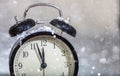 New Years eve countdown. Minutes to midnight on a vintage alarm clock Royalty Free Stock Photo
