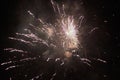 New Years Eve fireworks, several rockets exploding colourfully with many sparks in the beautiful night sky Royalty Free Stock Photo