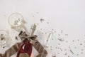 New years Eve holiday corner, banner. Bottle of champagne rose wine, glasses. Golden bow, star shape confetti isolated Royalty Free Stock Photo