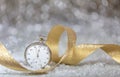 New Years eve party celebration. Minutes to midnight on an old fashioned watch, bokeh festive Royalty Free Stock Photo