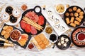 New Years Eve appetizer table scene. Overhead view on a white wood background.