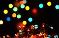 New Years garland colorful lights in snow Royalty Free Stock Photo