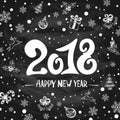 2018 New Years greetings with holiday decorations on black chalk Royalty Free Stock Photo