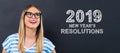 2019 New Years Resolutions with happy young woman Royalty Free Stock Photo