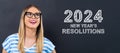 2024 New Years Resolutions with happy young woman