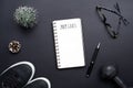 2019 new years resolutions sport flat lay composition. Black shoes, black dumbbells, glasses, blank notebook and Christmas Royalty Free Stock Photo