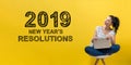2019 New Years Resolutions with woman using a laptop Royalty Free Stock Photo
