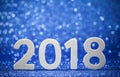 New Years 2018 white wood numbers on blue paper Royalty Free Stock Photo