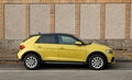 New yellow Audi A1, side view.