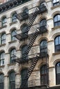 New York apartment building with exterior fire escape ladders