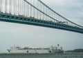 The USNS Comfort Hospital Ship leaves New York Harbor and sails under the Verrazzano-Narrows Bridge