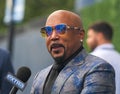 Daymond John, Entrepreneur and Co-star of ABC's Hit show Shark Tank, at the blue carpet before 2023 US Open opening ceremony