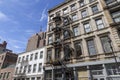 New york Fire escape stairs-downtown back alley architecture-steel and yellow brick background