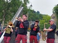 the new york brass band playing in the town square at the hebden bridge public arts festival
