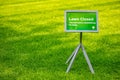 Bryant park, New York, Manhattan. Lawn closed sign on green grass background, sunny day in spring Royalty Free Stock Photo