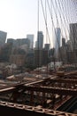 New York City Brooklyn Bridge in Manhattan closeup with skyscrapers and city skyline over Hudson River. Royalty Free Stock Photo