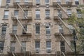 New York City building facades with fire escape stairs Royalty Free Stock Photo