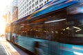 New York City bus driving down the street through Manhattan with motion blur effect Royalty Free Stock Photo