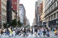 NEW YORK CITY - CIRCA 2017: Crowds of busy people walk across th