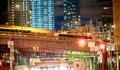 New York City - December 3rd, 2018: Lincoln Tunnel Expressway entrance with city traffic and buildings at night Royalty Free Stock Photo