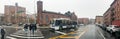 NEW YORK CITY - DECEMBER 2, 2018: Tourists walk along Harlem streets on a rainy day, panoramic view. The city attracts 50 million