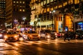 New York City, East 46th Street, Manhattan - November 1, 2017: Smoke pours out of manhole cover behind line of yellow cabs at nigh Royalty Free Stock Photo