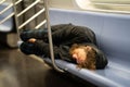 New York City empty streets, homeless man sleeping in train Royalty Free Stock Photo