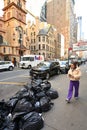 Black plastic trash bags full of garbage