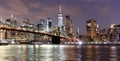 New York City, financial district in lower Manhattan with Brooklin Bridge at night, USA Royalty Free Stock Photo
