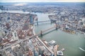 New York City from helicopter point of view. Brooklyn, Manhattan and Williamsburg Bridges with Manhattan skyscrapers on a cloudy