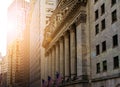 New York City historic buildings of the financial district in lower Manhattan near Wall Street with sunlight glowing in the Royalty Free Stock Photo