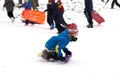 New York City - January 27: Kid enjoys the snow day as he slides down a hill