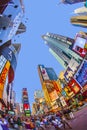 people enjoy the evening at at Times Square in New York City